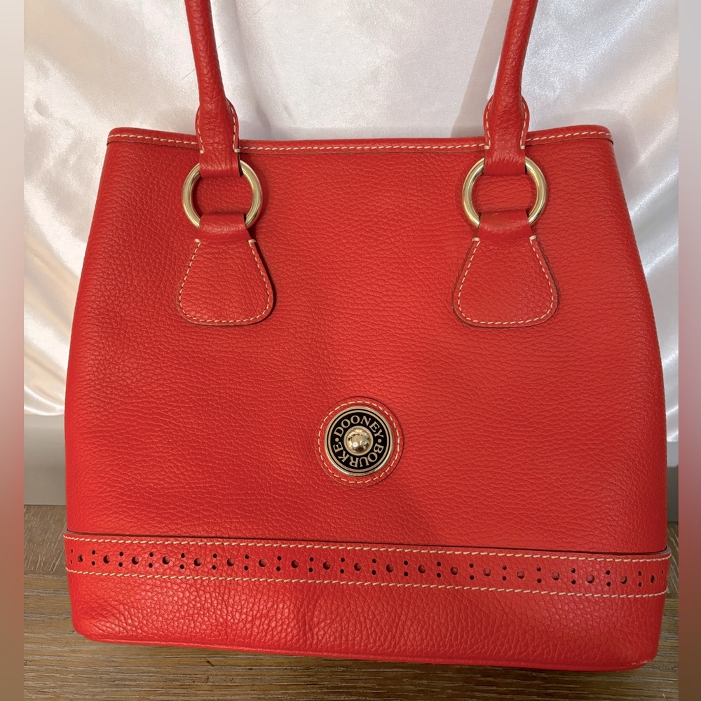 NEW Dooney & Bourke dark orange leather purse. Lt tan interior. NWOT